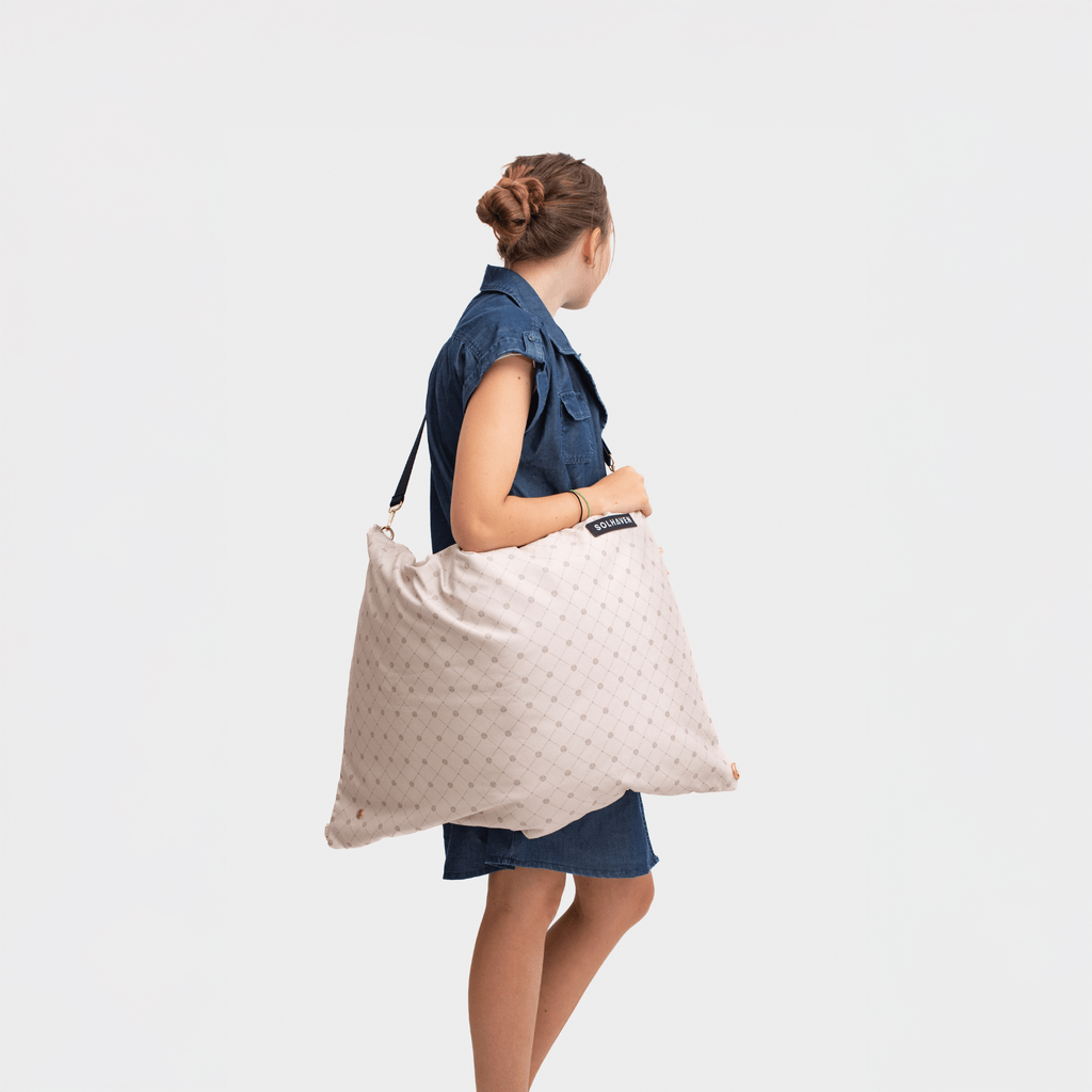 Womena carrying a Dream First™ Pillow Bag over her shoulder - Sole - Solhaven