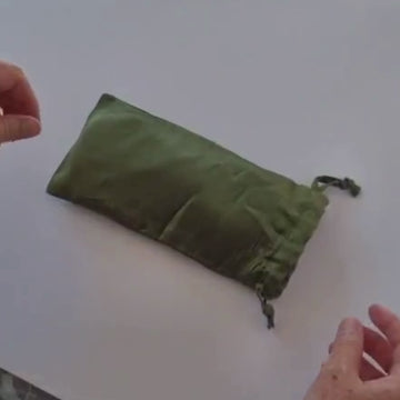 video removing a silk eye mask from its travel bag