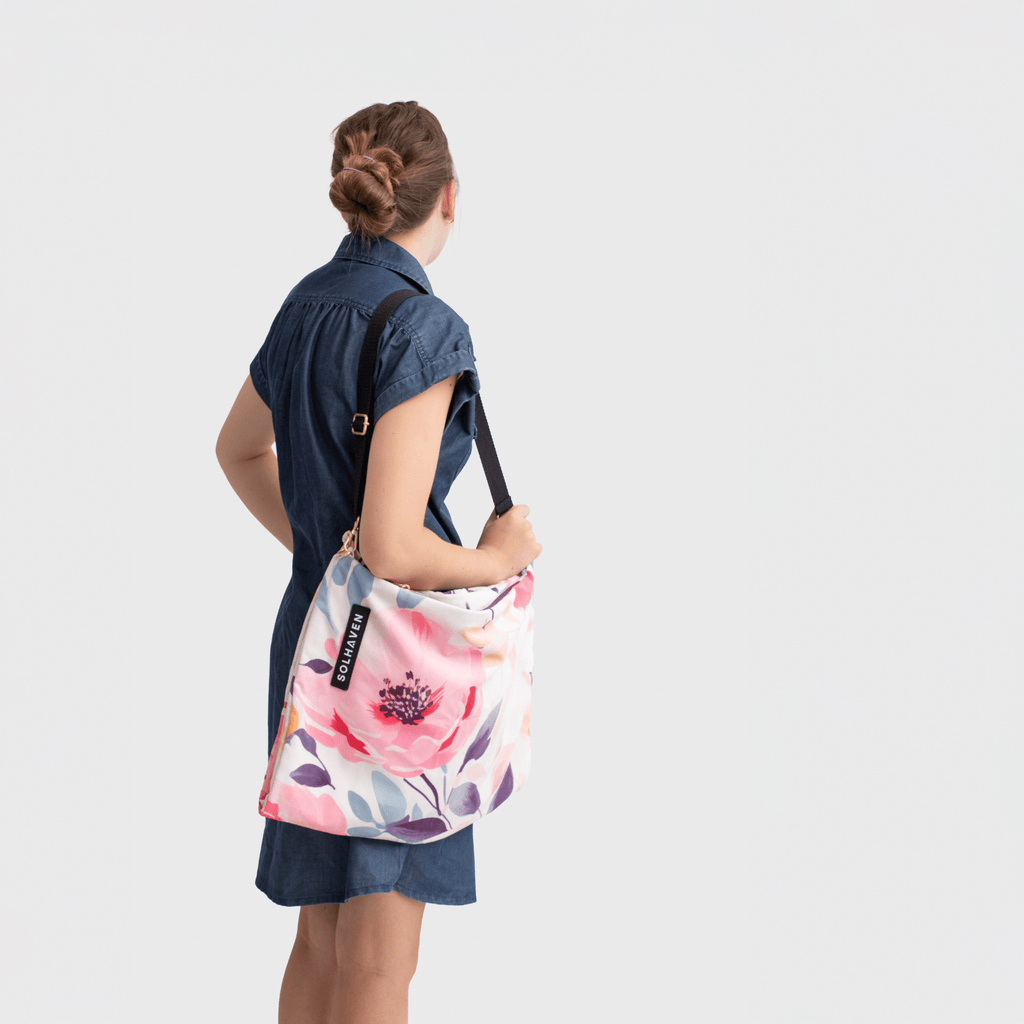 Dream First™ Pillow Bag - Flora - Solhaven with a model carrying an empty bag on her shoulder