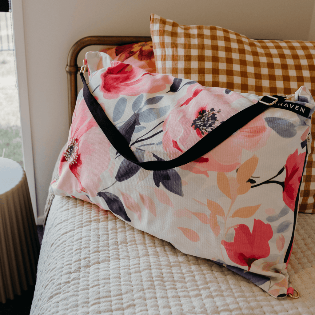 Dream First™ Pillow Bag - Flora - Solhaven sitting on a bed