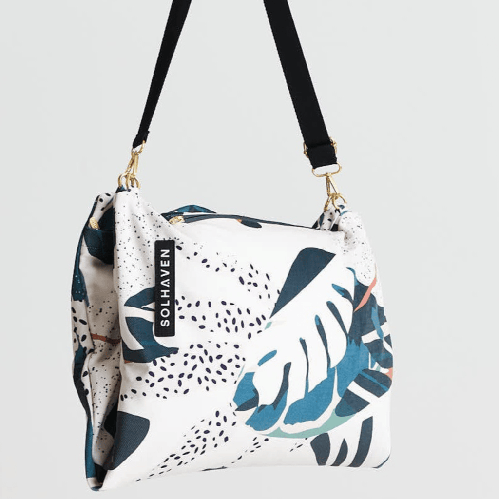 Dream First™ Pillow Bag - Tropic - Solhaven, shown hanging from strap folded in half
